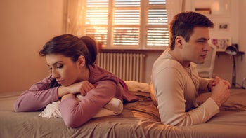 Health: Relationships: 	tense couple on bed 529410892