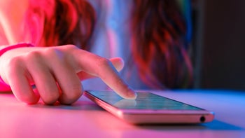 Mental-health: closeup teenager scrolling on smartphone 1354022389