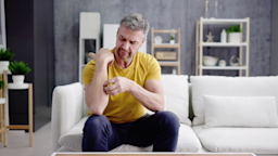 A man scratches a rash on his arm.
AndreyPopov/iStock via Getty Images Plus