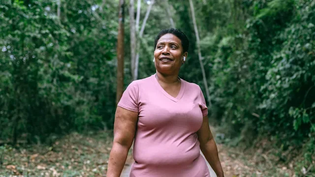 Movement Exercise: woman enjoying a walk outdoors 1424748773