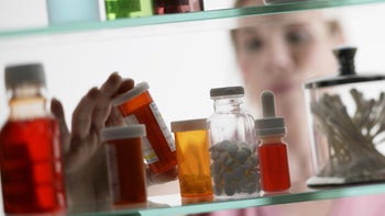 Medication education: Organization: taking bottle from medicine cabinet-78430411