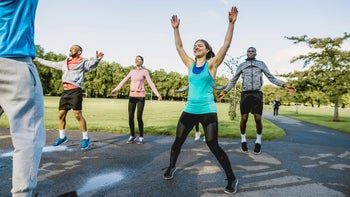 Movement exercise: group doing jumping jacks 959161726