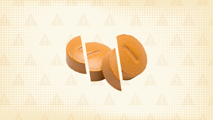 Orange background with texture and warning sign pattern. In the center are two orange pills cut into thirds. 