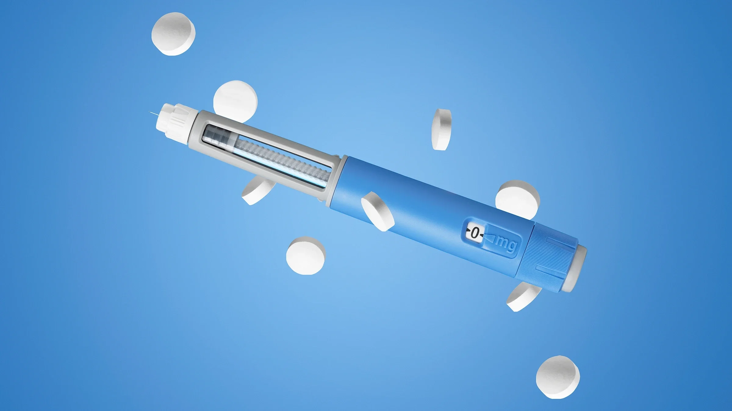 Weight-loss pills and dosing pen on a blue background.