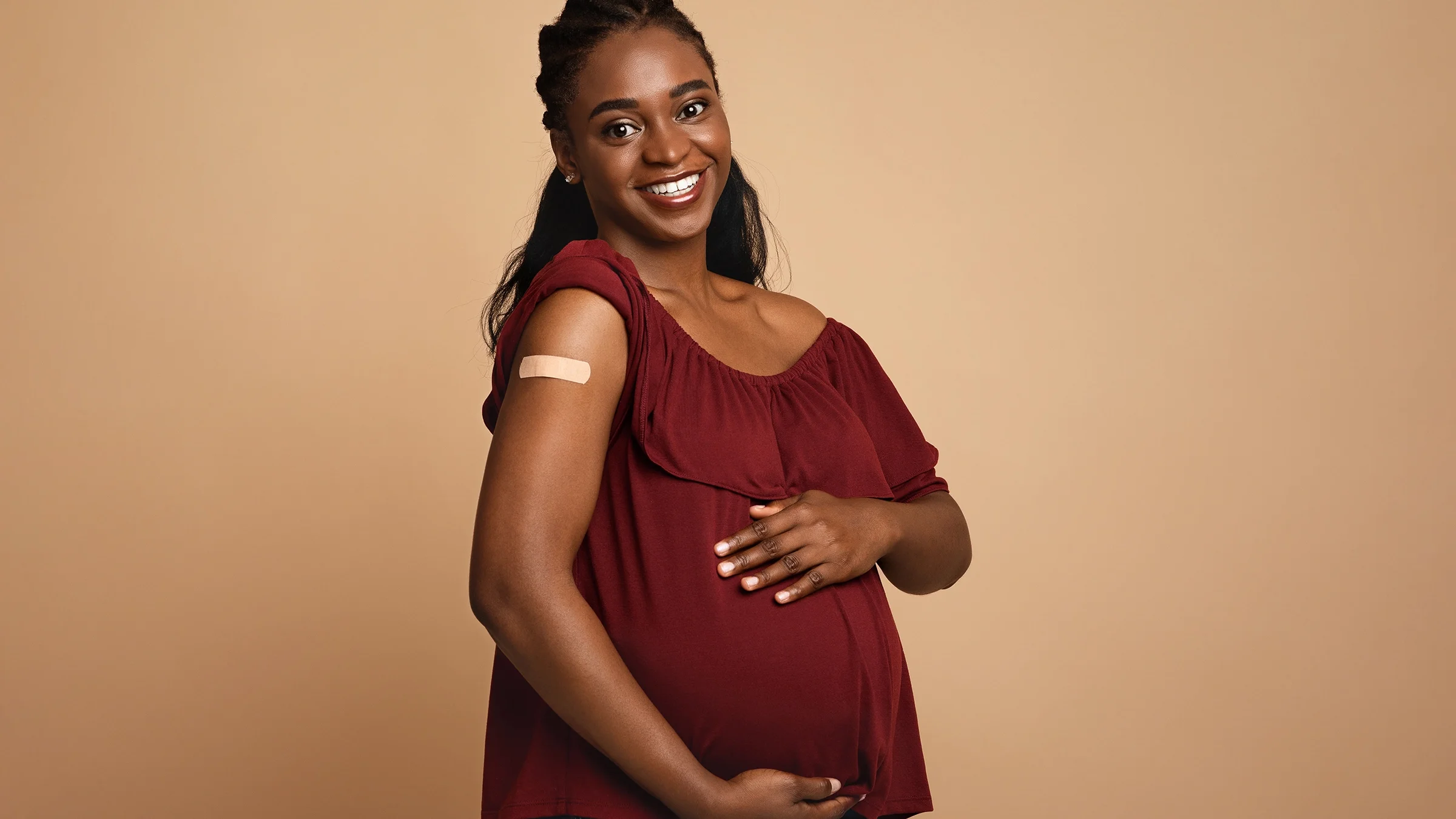 Portrait of pregnant woman after vaccine shot