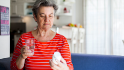 Senior woman taking a pill with glass of water
Daniela Jovanovska-Hristovska/E+ via Getty Images
