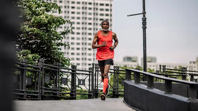 Movement and exercise: man running in street 1223271968