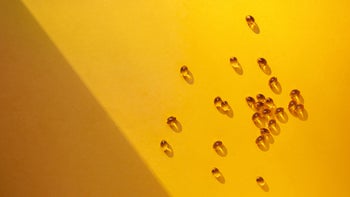 Supplements and Herbs: vitamins on yellow surface 1258232578
