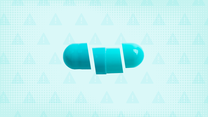 Teal background with texture and warning sign pattern. In the center is a teal capsule pill cut into thirds. 