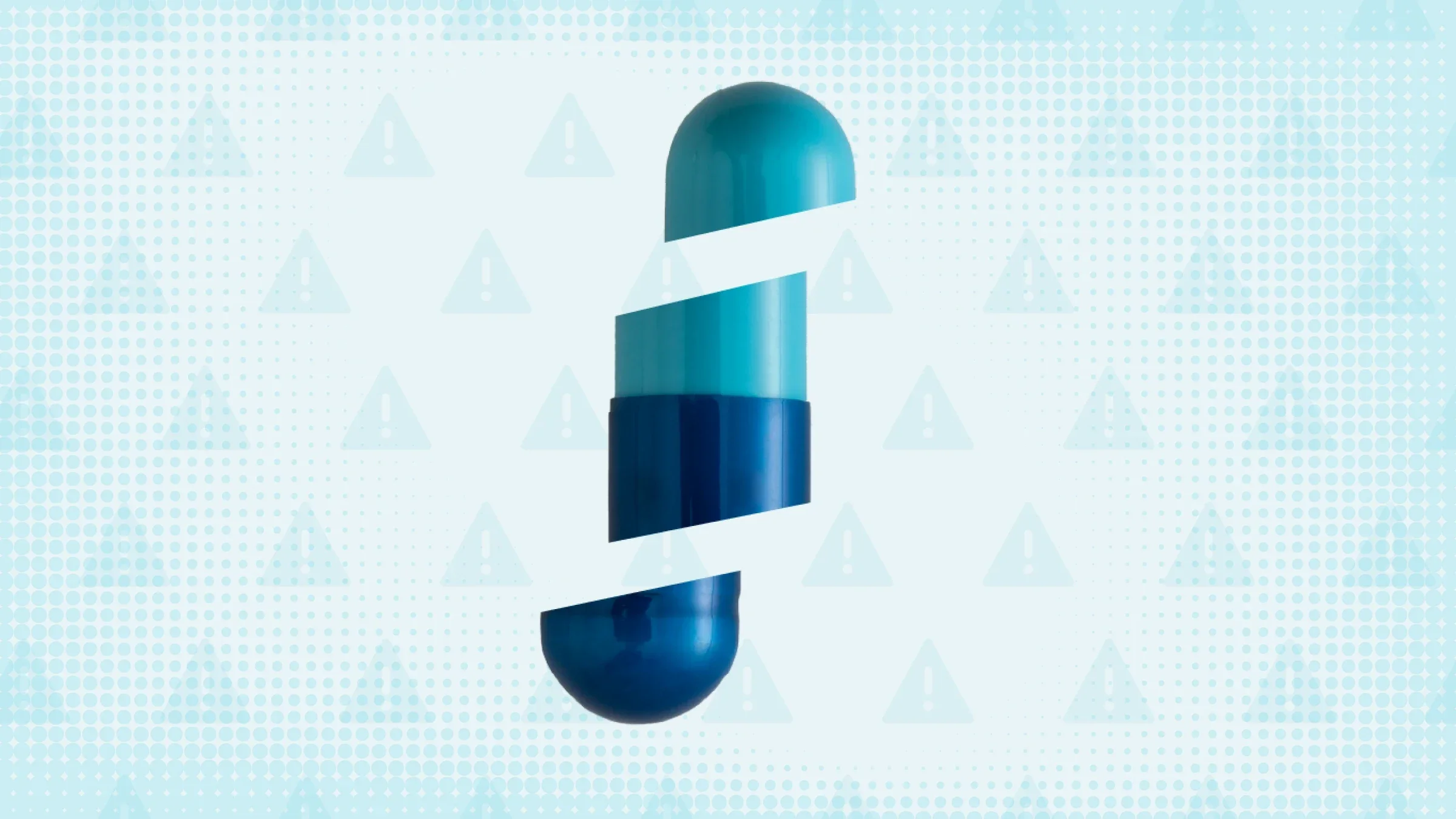 Light teal background with halftone texture and warning sign pattern. In the center is a blue and teal capsule cut into thirds.
GoodRx Health
