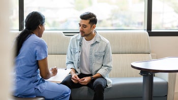 depression: man speaking to healthcare professional 1500155036