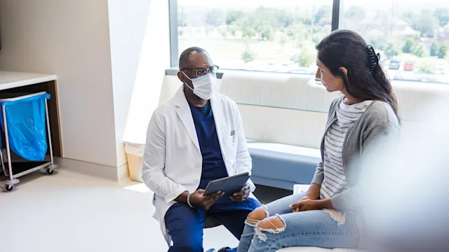 Women's Health: Abortion: doctor speaks to patient 1414481917