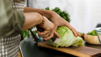 Diet Nutrition: closeup cutting iceberg lettuce 1354859058