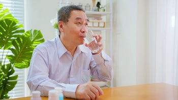 Diet Nutrition: senior man taking medication with water 1388348120