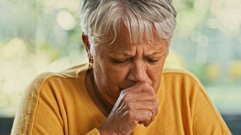 Pneumonia: senior woman coughing 1359616226