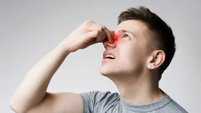 Nasal Polyps: Nasal Congestion: Cold: Allergies: man with nose pain 1166775553