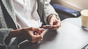 Dramamine: woman on plane takes pills 1407133443