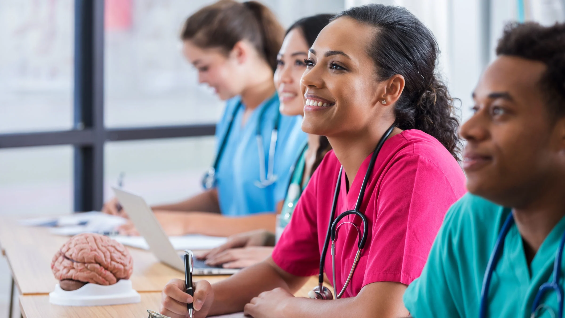 Nurses smiling during orientation.