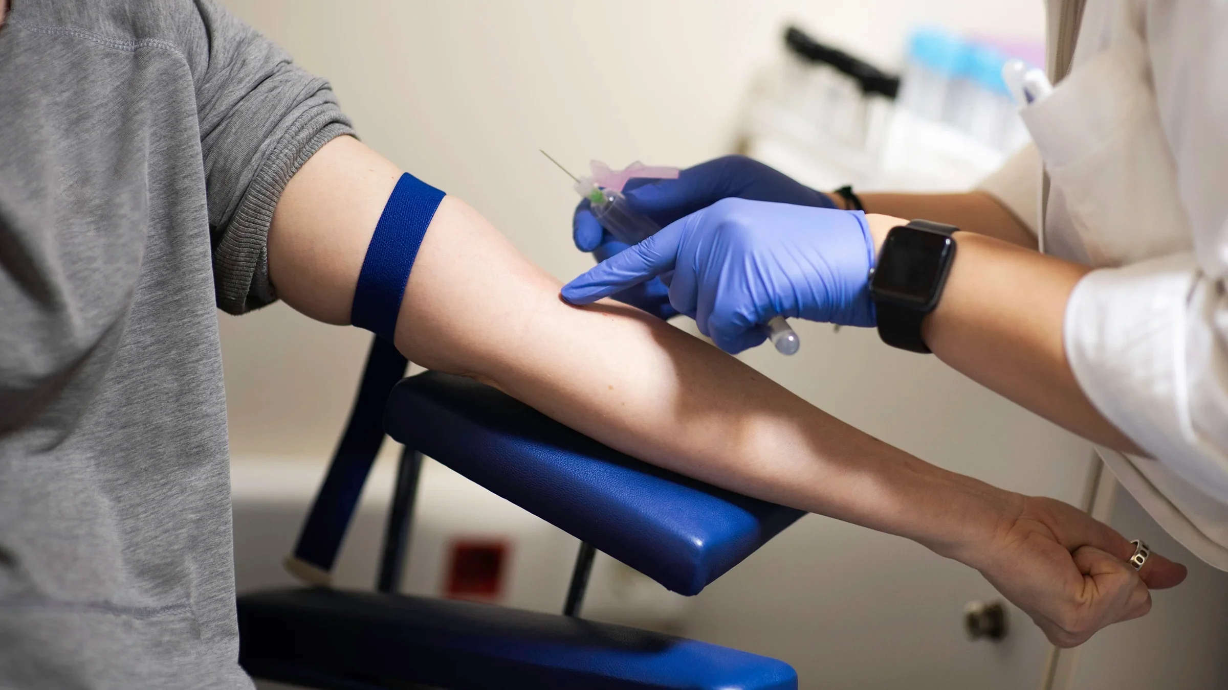 A person has their blood drawn in the lab. An absolute neutrophil count can help you know if your body is fighting an infection or other health conditions.