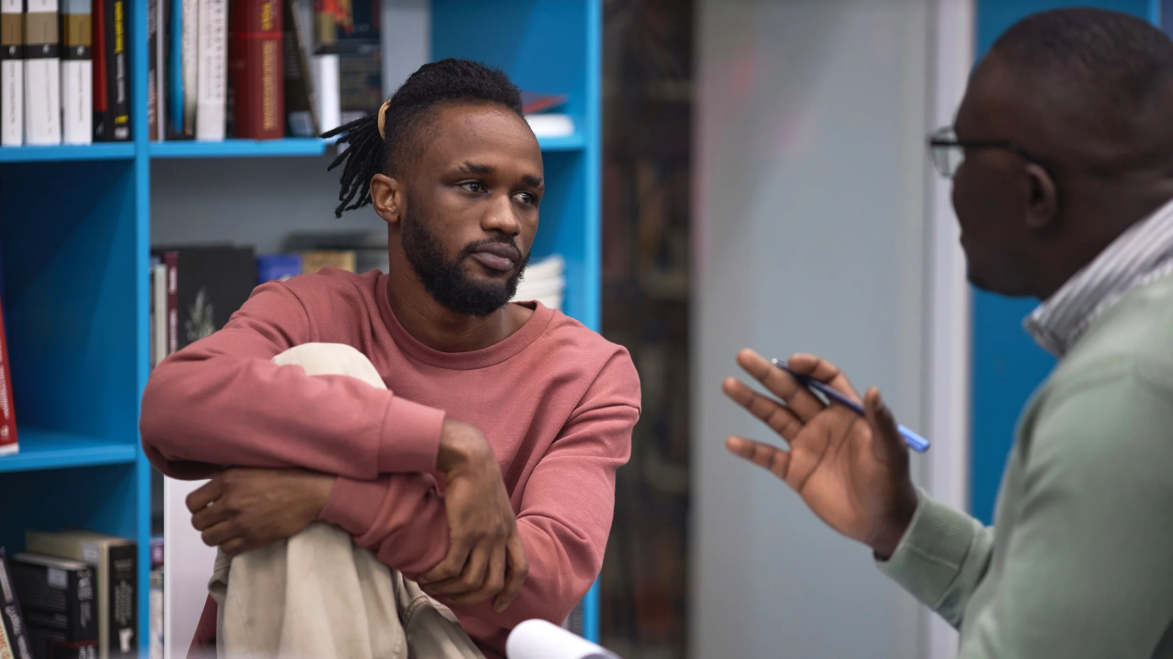 A man listens to his therapist.