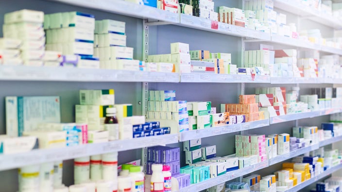 Pharmacy shelves filled with medication. 