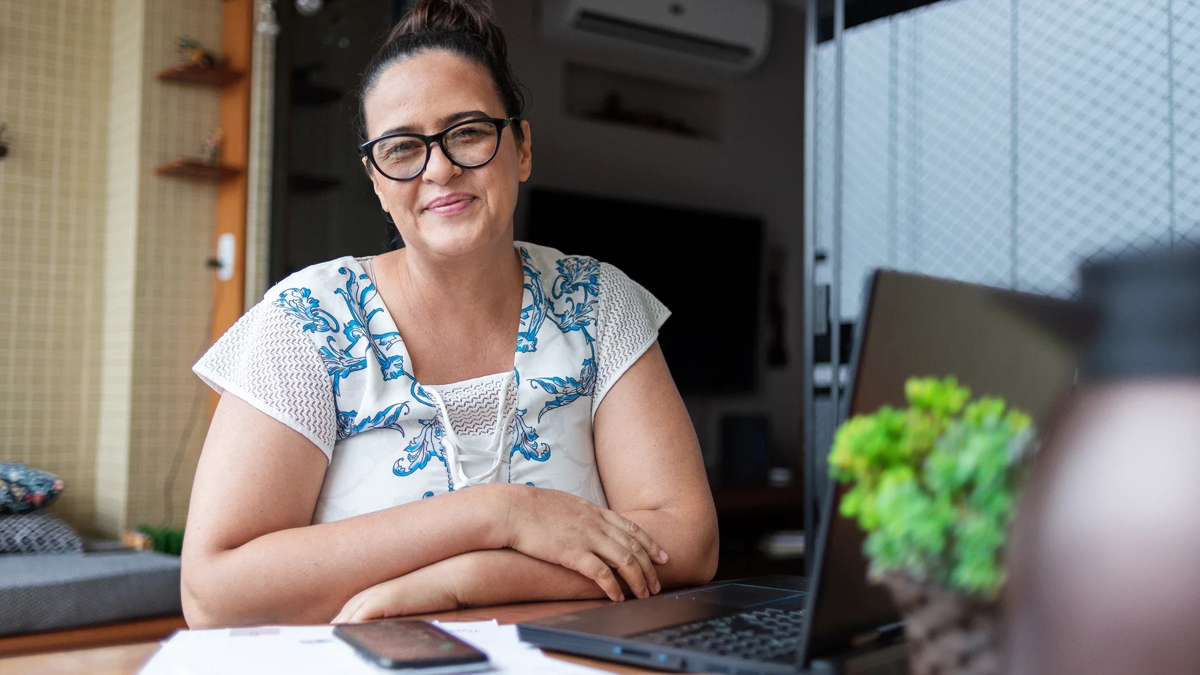 A portrait of a woman doing her finances at home.
wagnerokasaki/iStock via Getty Images Plus