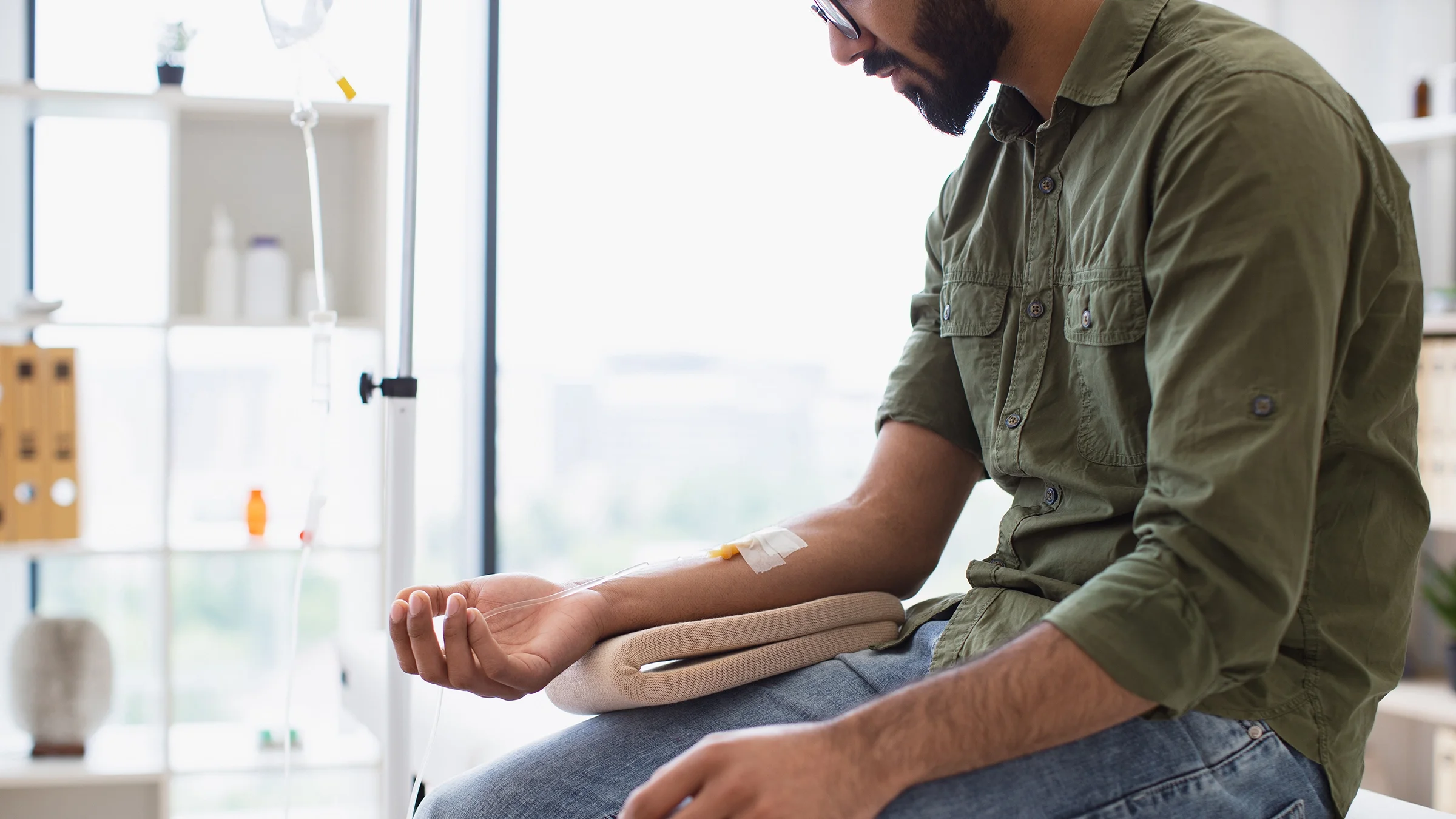 Man receiving IV drip.