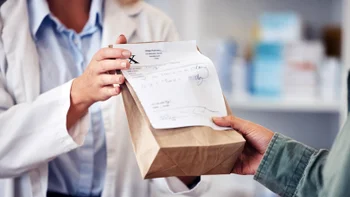 Pharmacy: closeup picking up a Rx 1676140055