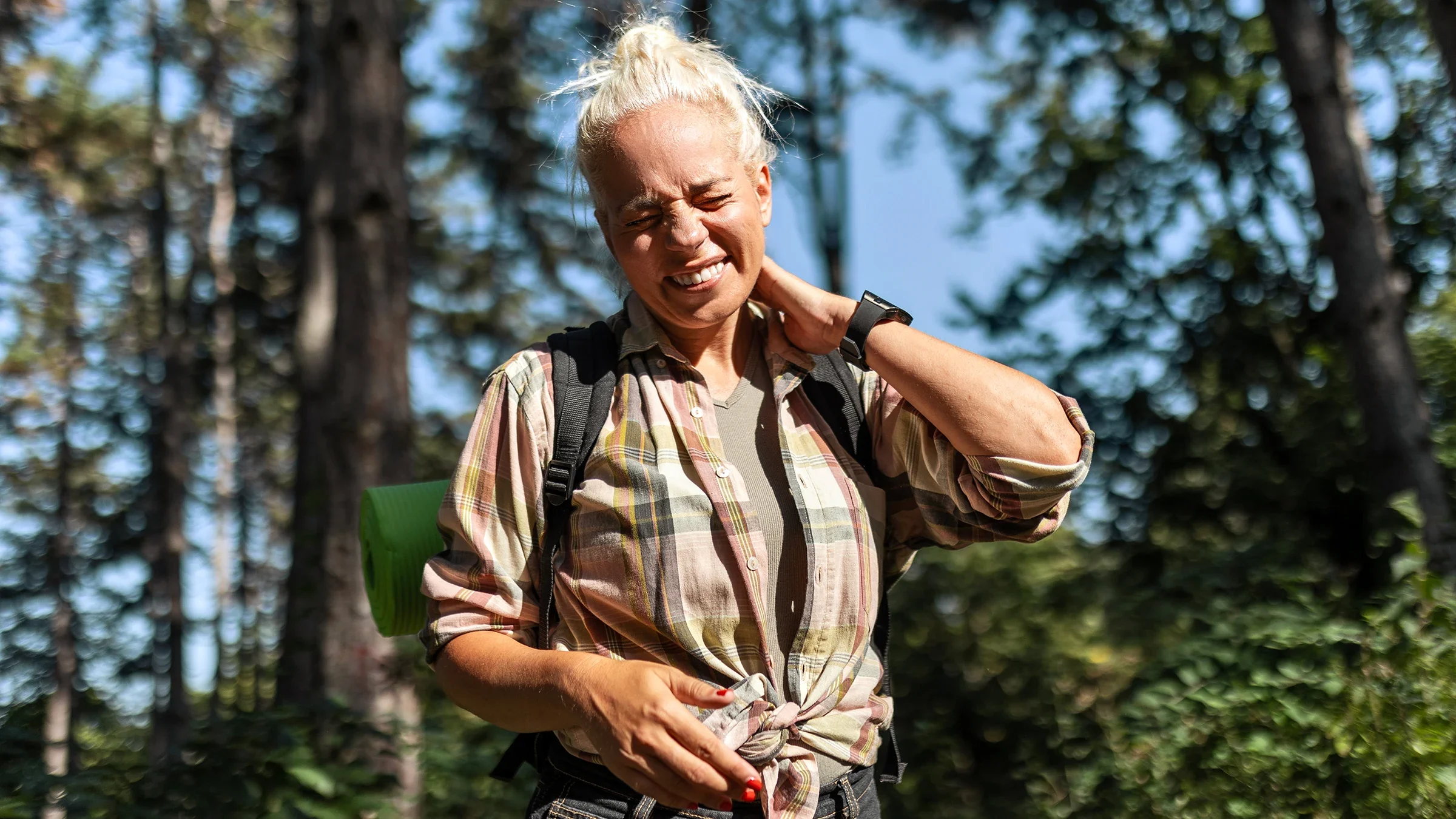 Woman outdoors itching from a bug bite.
Zorica Nastasic/E+ via Getty Images