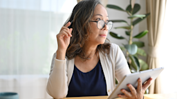 A woman does research on her tablet at home.
BongkarnThanyakij/iStock via Getty Images Plus