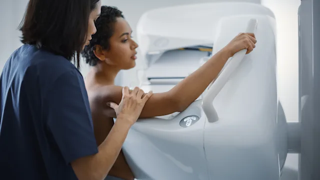 Breast cancer: woman at mammogram scan 1352435554