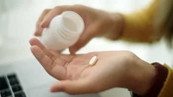 Medication Education: closeup pill in palm of hand 2164785924