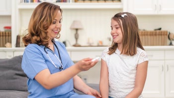 Humira: Dosage: doctor explaining injection pen 1158514503