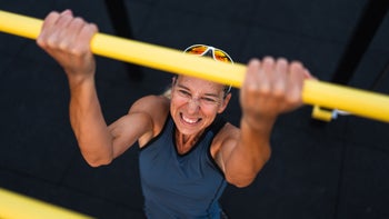 Movement-exercise: woman doing pull up exercise 1749525856