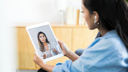 A woman speaks to her healthcare provider during a telemedicine appointment.
SDI Productions/E+ via Getty Images