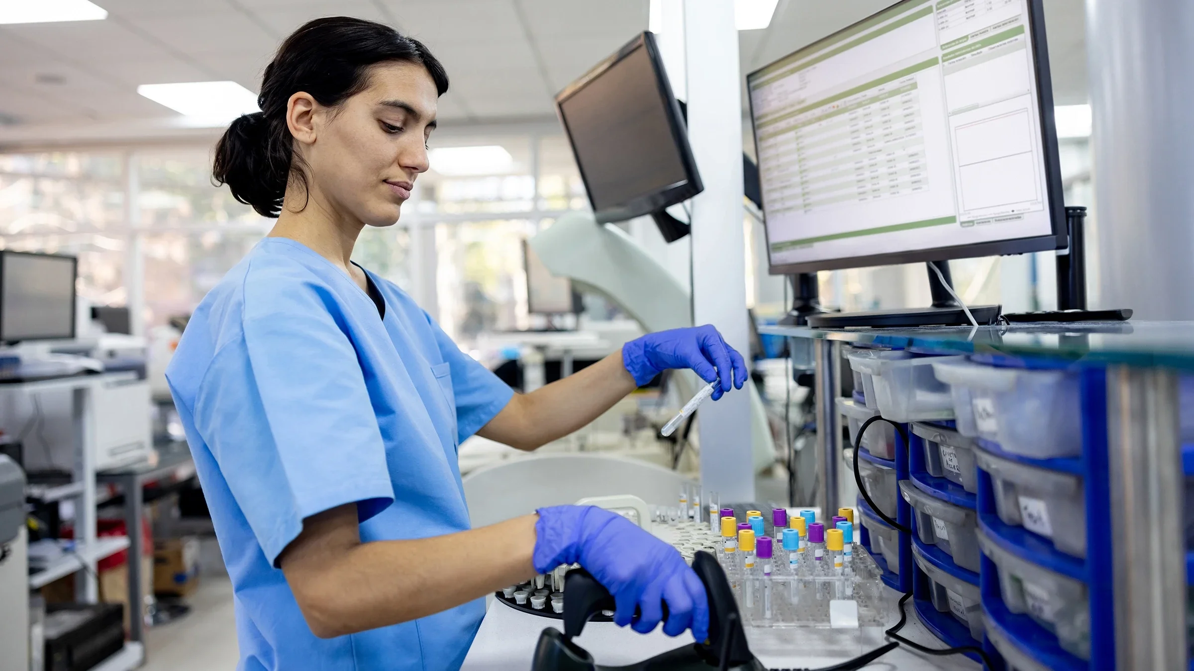 Hematologist analyzing medical samples in a lab
