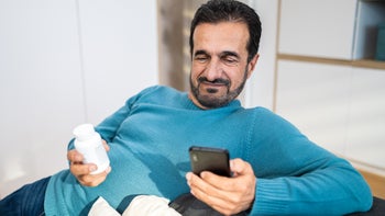 gaba-agonists: man researching medication on smartphone 1473378723
