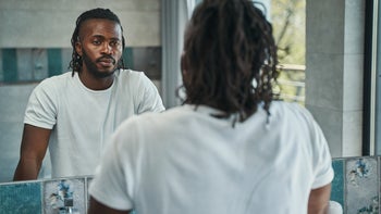 Health: Mens health: man looking at reflection 1354175926