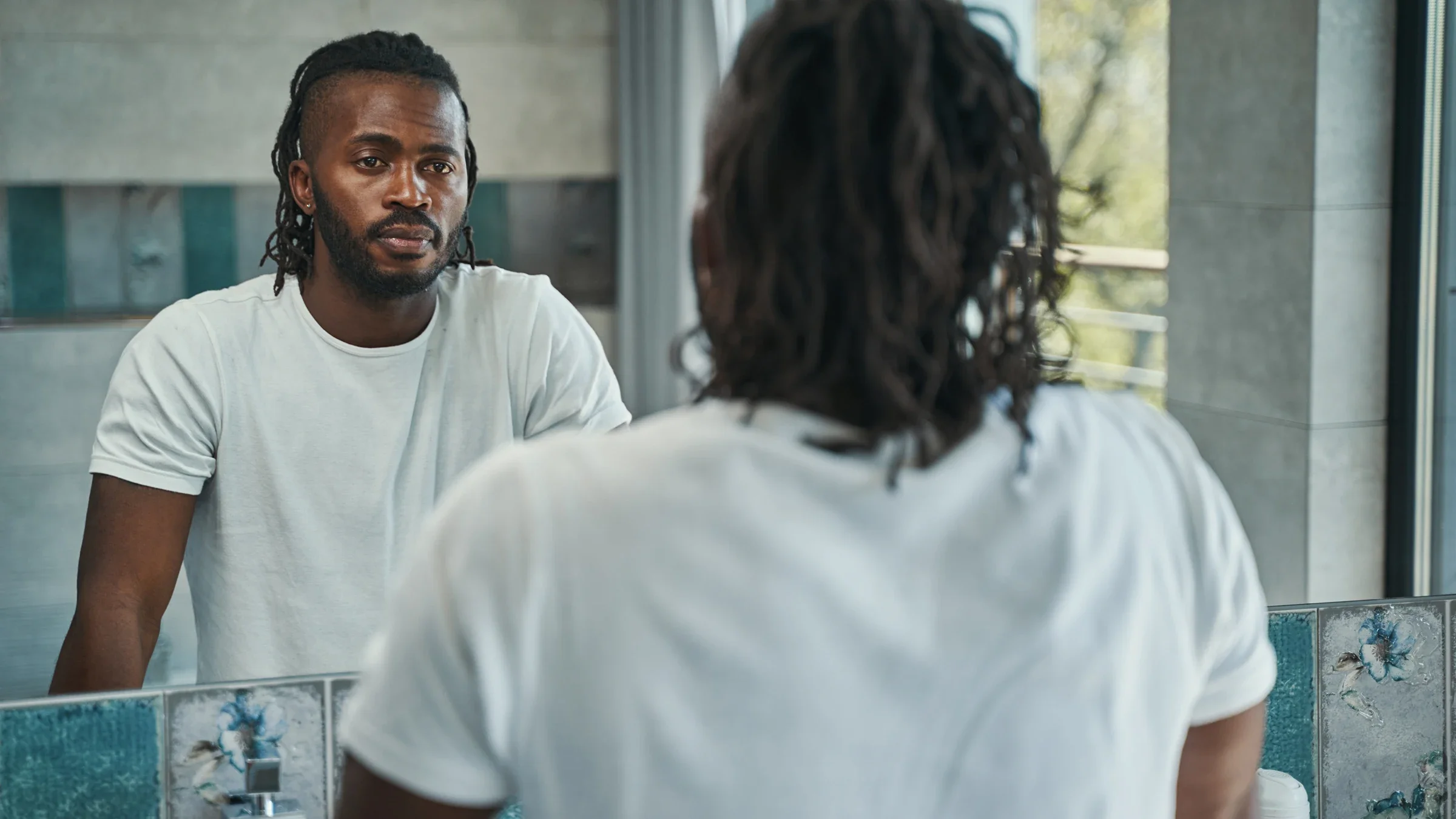 Health: Mens health: man looking at reflection 1354175926