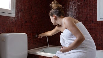 women's health: woman preparing a bath 1473773036