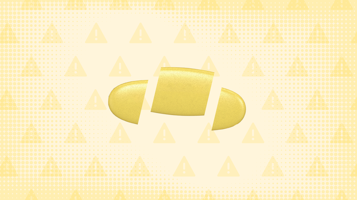 In the center of a pale yellow background with texture and warning sign pattern is a yellow oblong pill cut into thirds.  