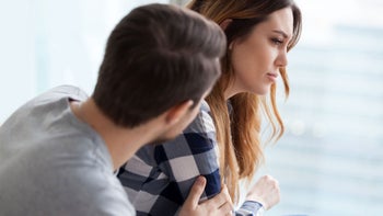 Substance use disorderL woman being consoled 1051395358