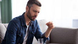 A man takes a pill with a glass of water.
Prostock-Studio/iStock via Getty Images Plus