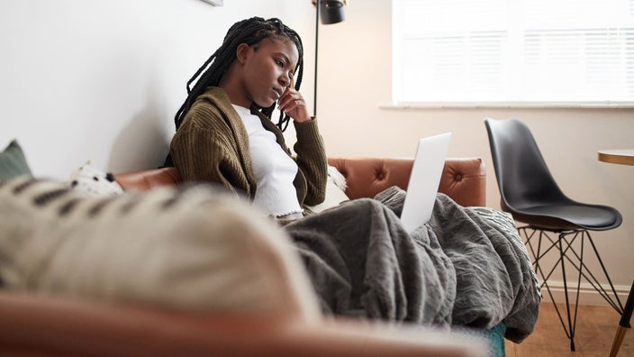A person looking up information on their computer.