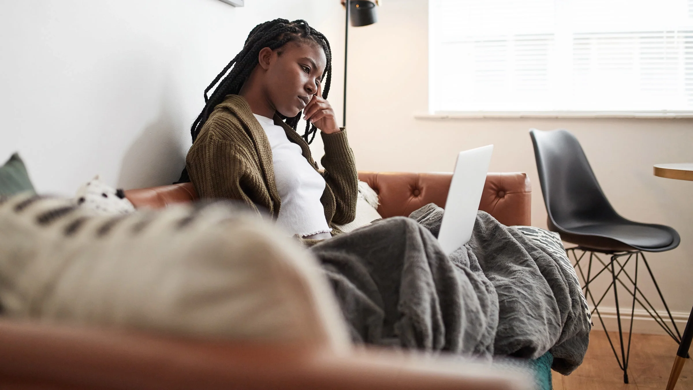 A person looking up information on their computer.