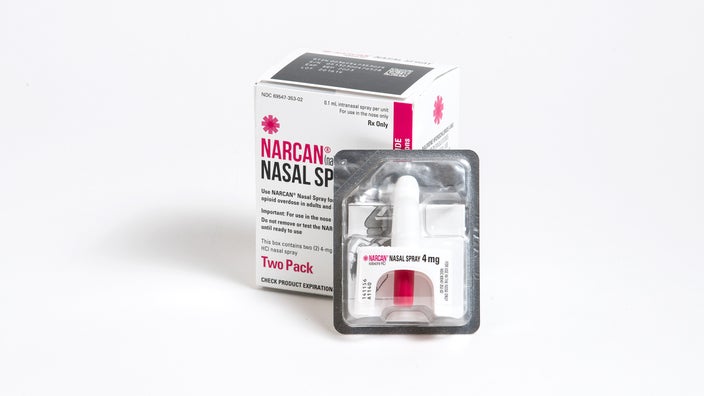 Product shot of Narcan nasal spray and packaging on a white background.