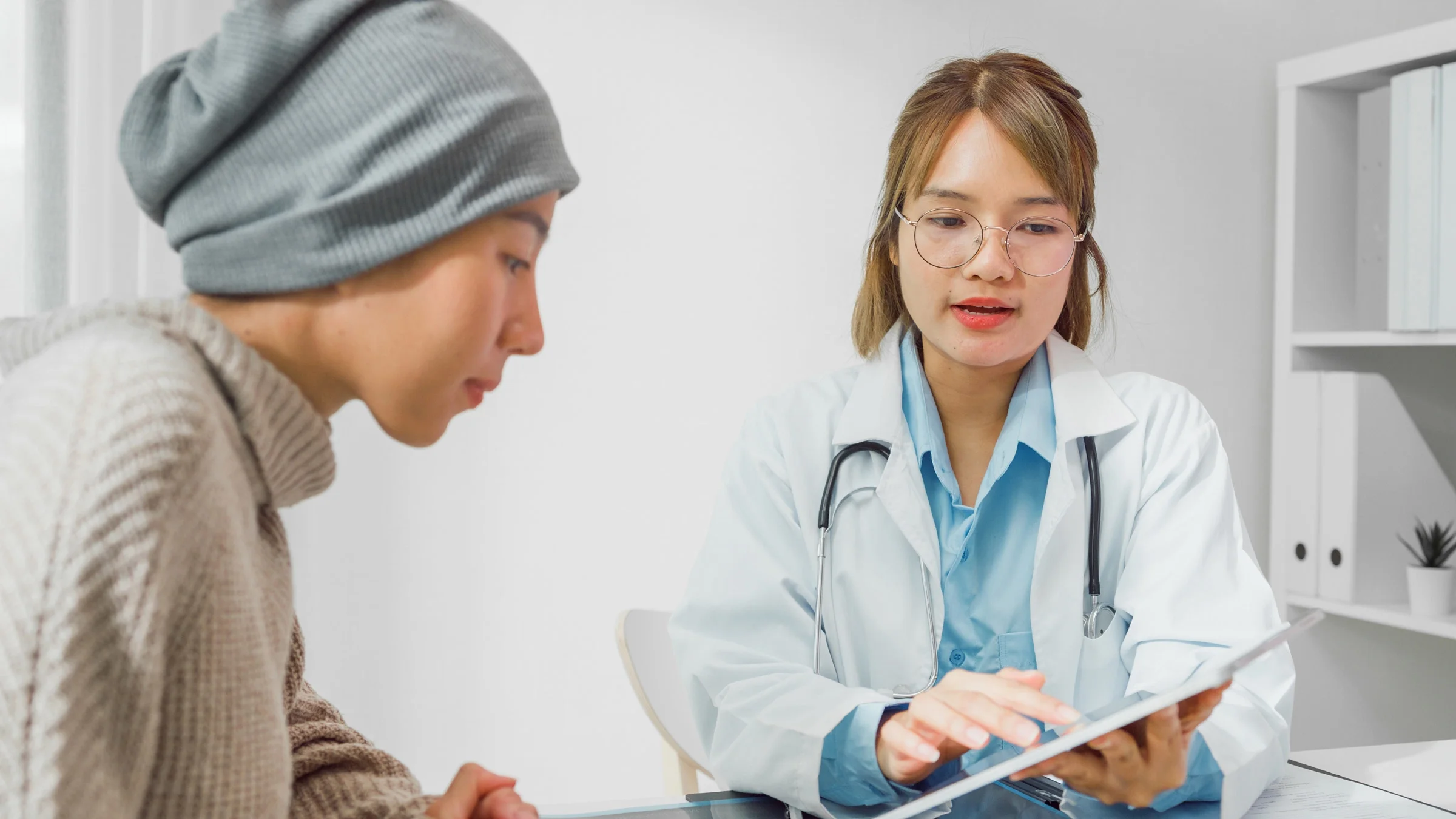 A doctor talking to a cancer patient.