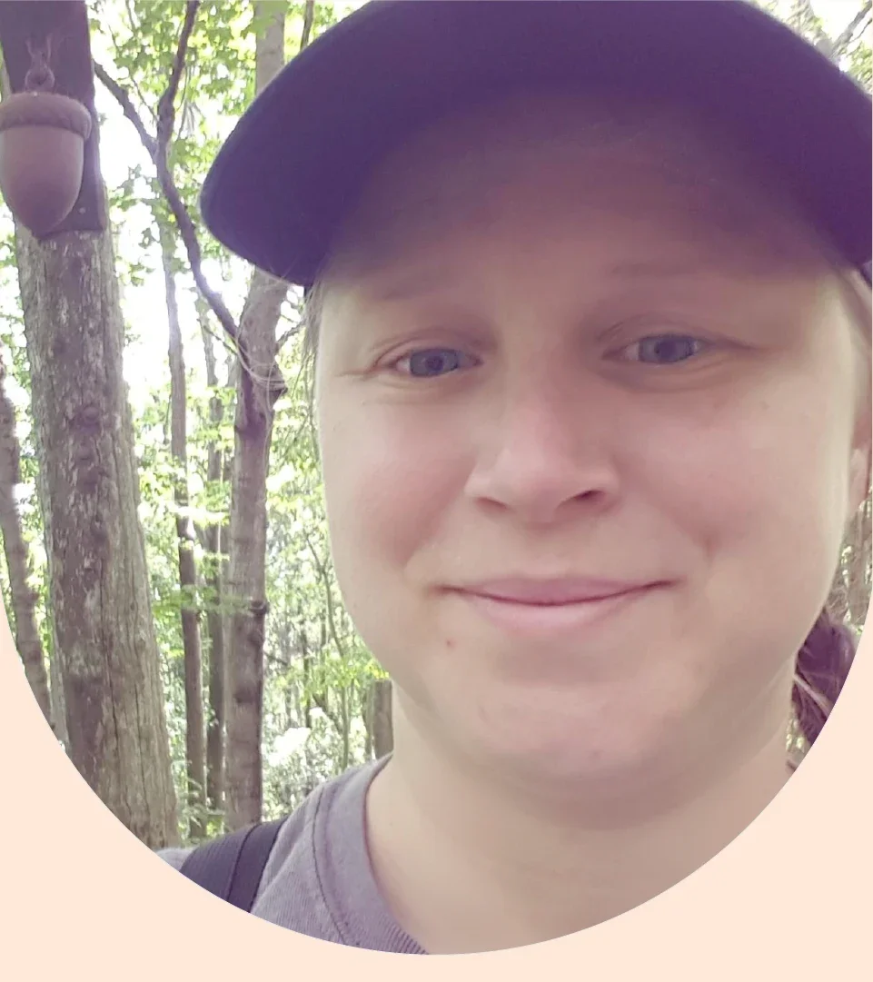 Daphne Leigh is pictured in a headshot.