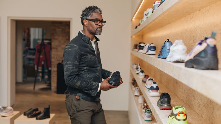 A man shops for running shoes.