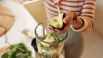 Diet Nutrition: closeup scooping avocado 2222050044